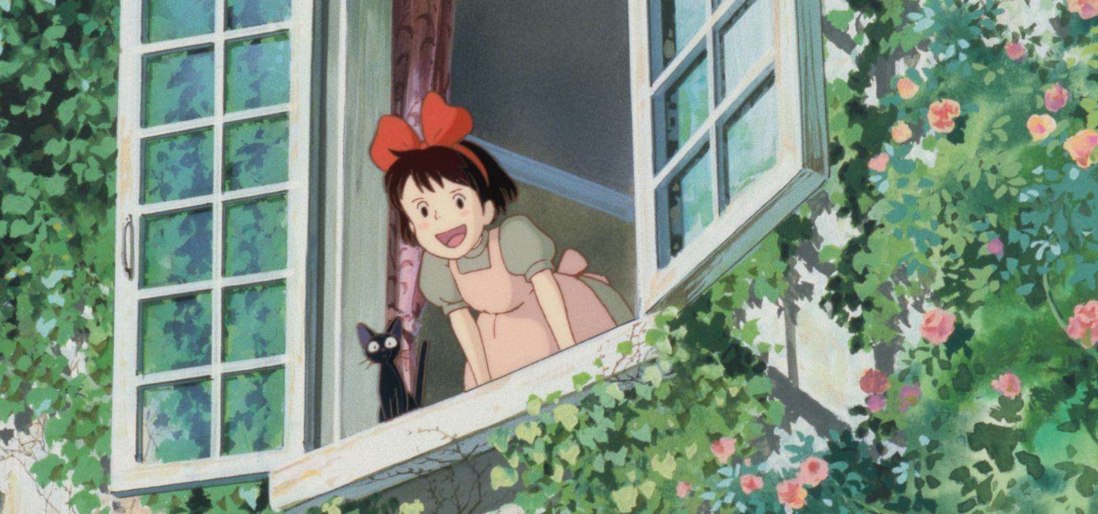 An anime illustration from Kiki's Delivery Service. A young girl, Kiki, leans out of a wide open, white-framed window with a cheerful, open-mouthed smile. She wears a light pink dress with an apron and a signature large red bow in her short brown hair. Next to her on the windowsill sits a small, wide-eyed black cat, Jiji. The outside wall of the building is heavily blanketed in lush green climbing ivy and dotted with small pink and orange roses.