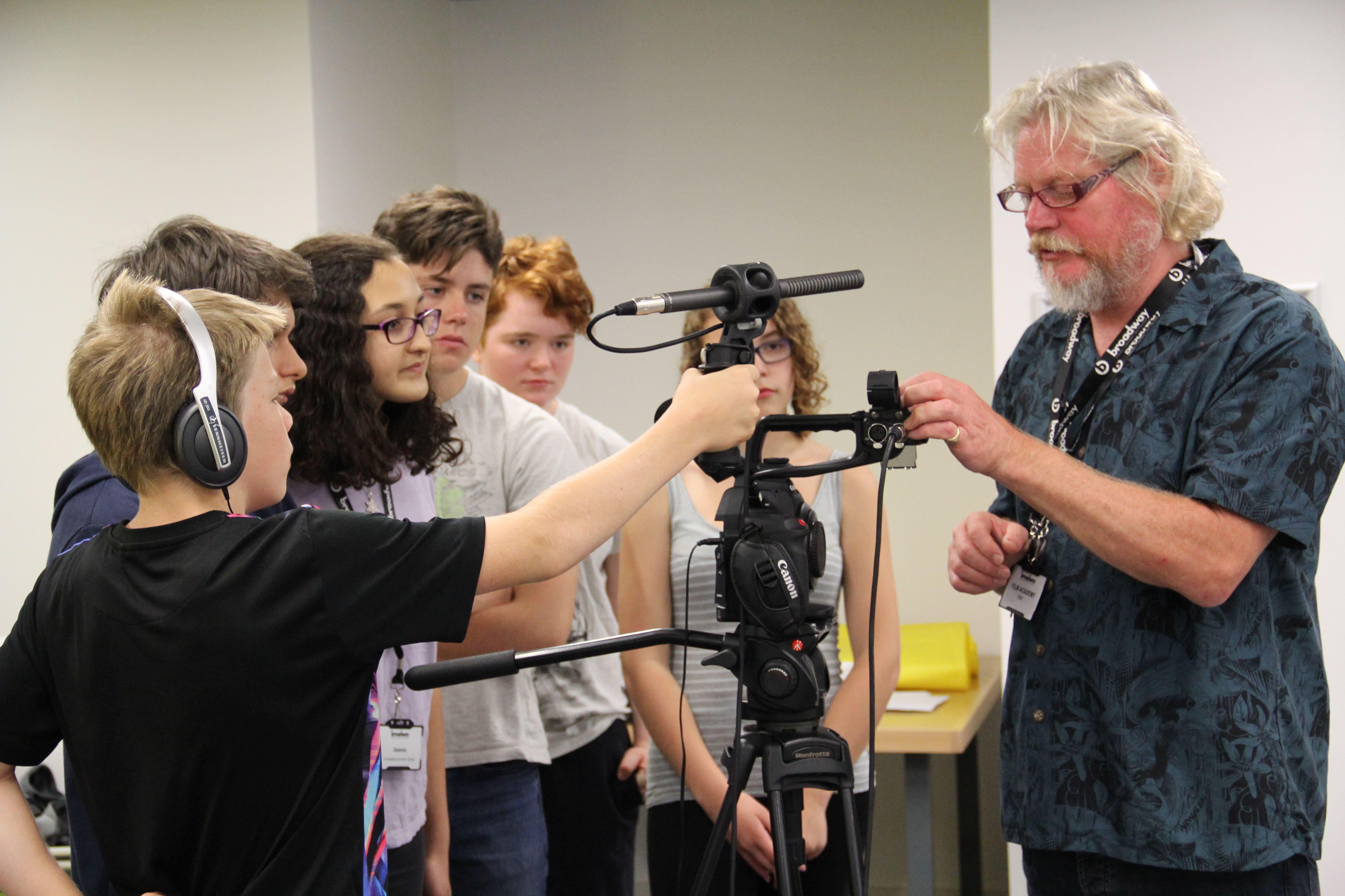 Into-film-members-being-shown-how-to-use-equipment