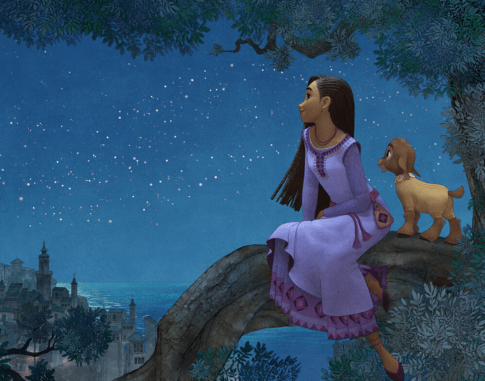 A young woman sits on a large tree branch looking out across an ancient nighttime cityscape alongside a goat